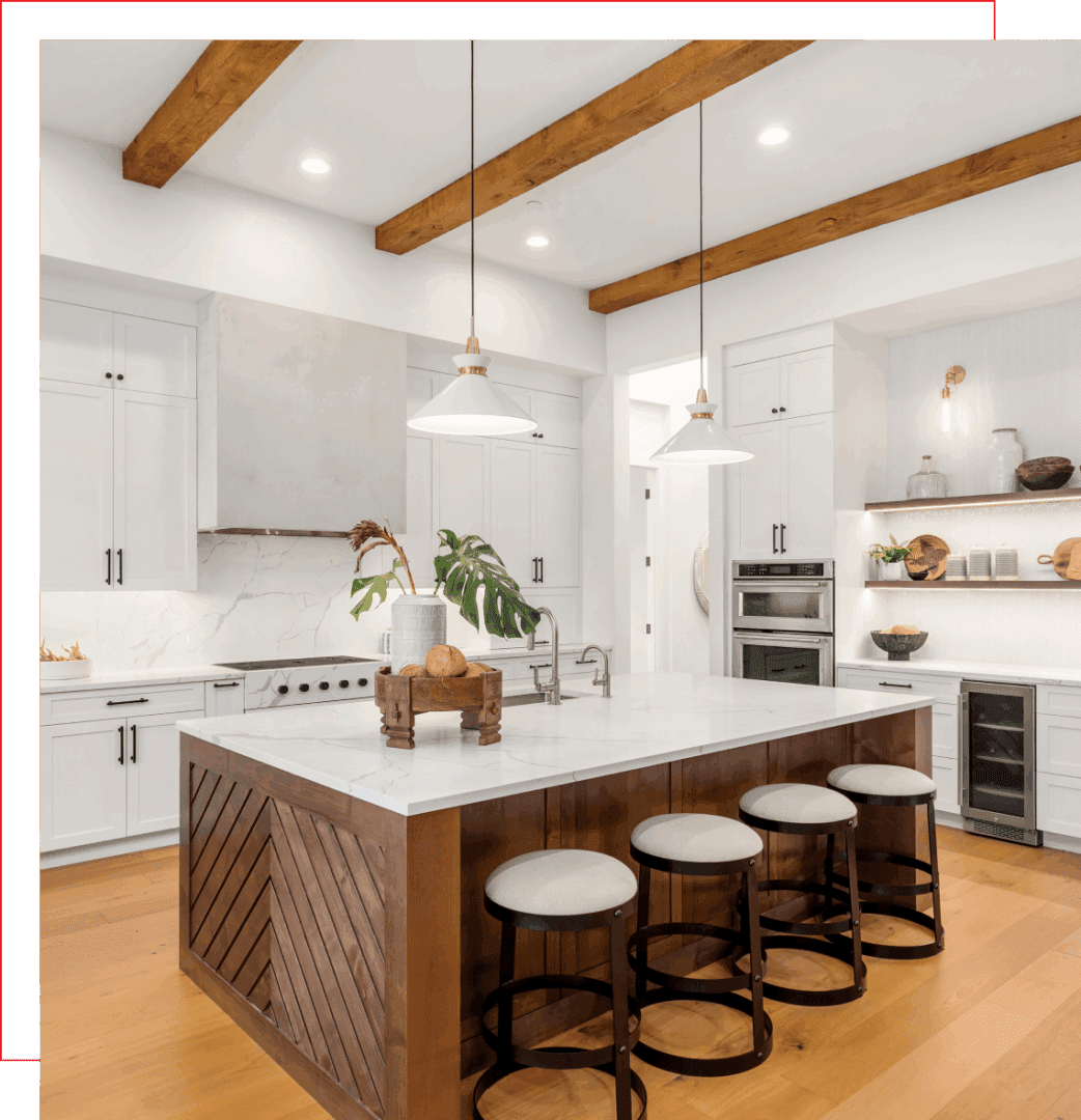 Modern kitchen with island and wooden beams.