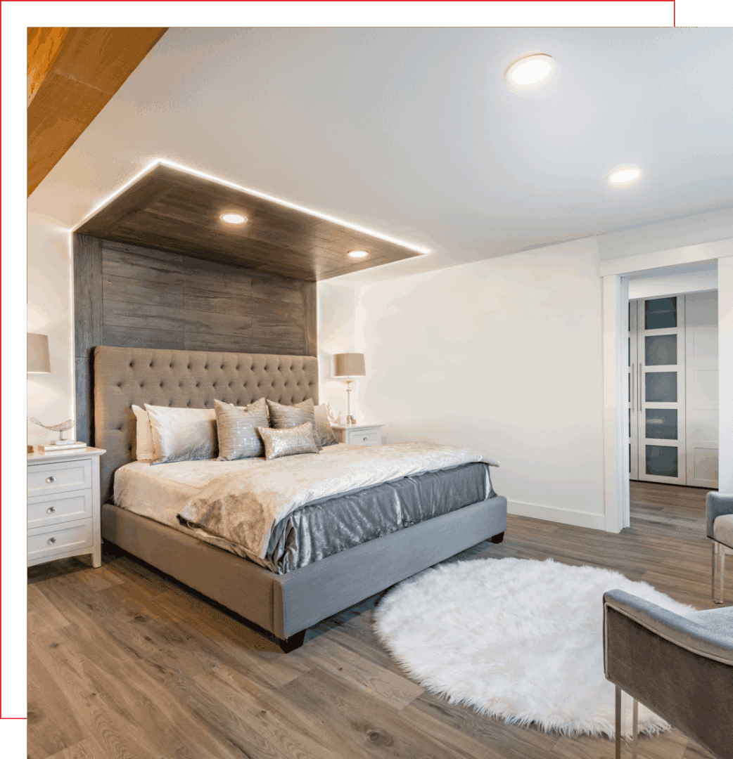 Modern bedroom with stylish decor and lighting.